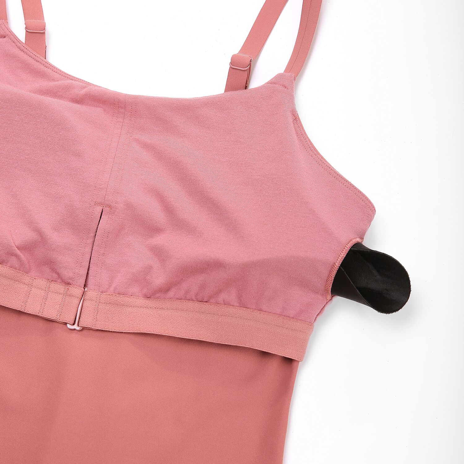 A stylish women's workout tank top featuring adjustable spaghetti straps and a built-in bra, perfect for yoga and athletic activities.