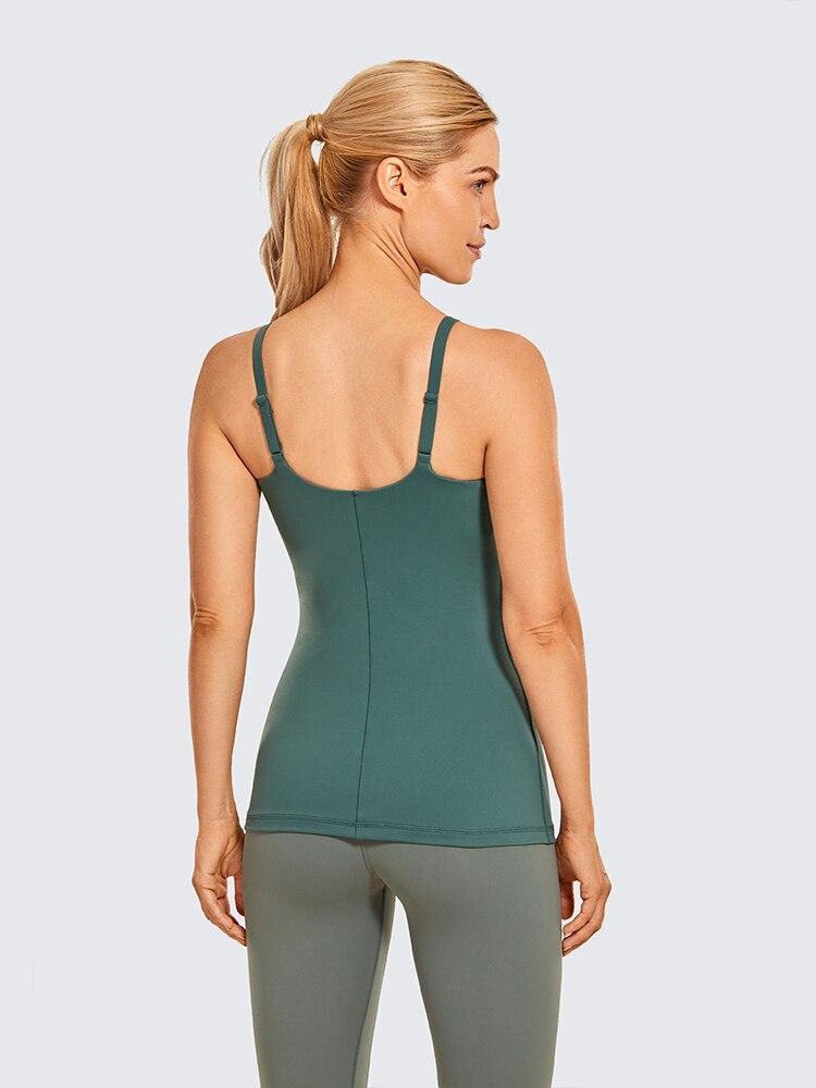 A stylish women's workout tank top featuring adjustable spaghetti straps and a built-in bra, perfect for yoga and athletic activities.