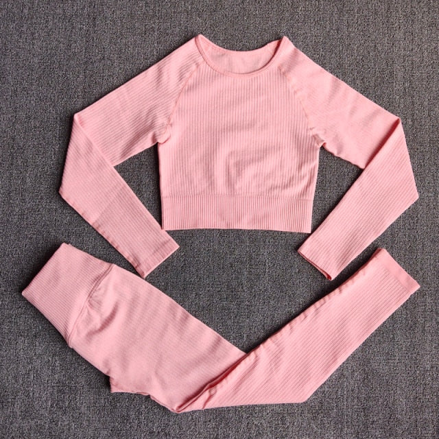 A stylish seamless yoga set for women, featuring leggings, a fitness bra, and a crop top in various colors including pink and black.