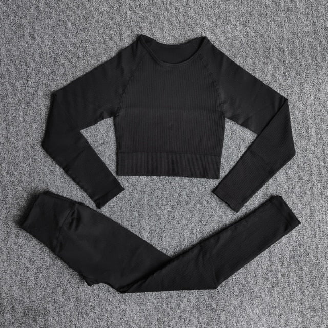 A stylish seamless yoga set for women, featuring leggings, a fitness bra, and a crop top in various colors including pink and black.