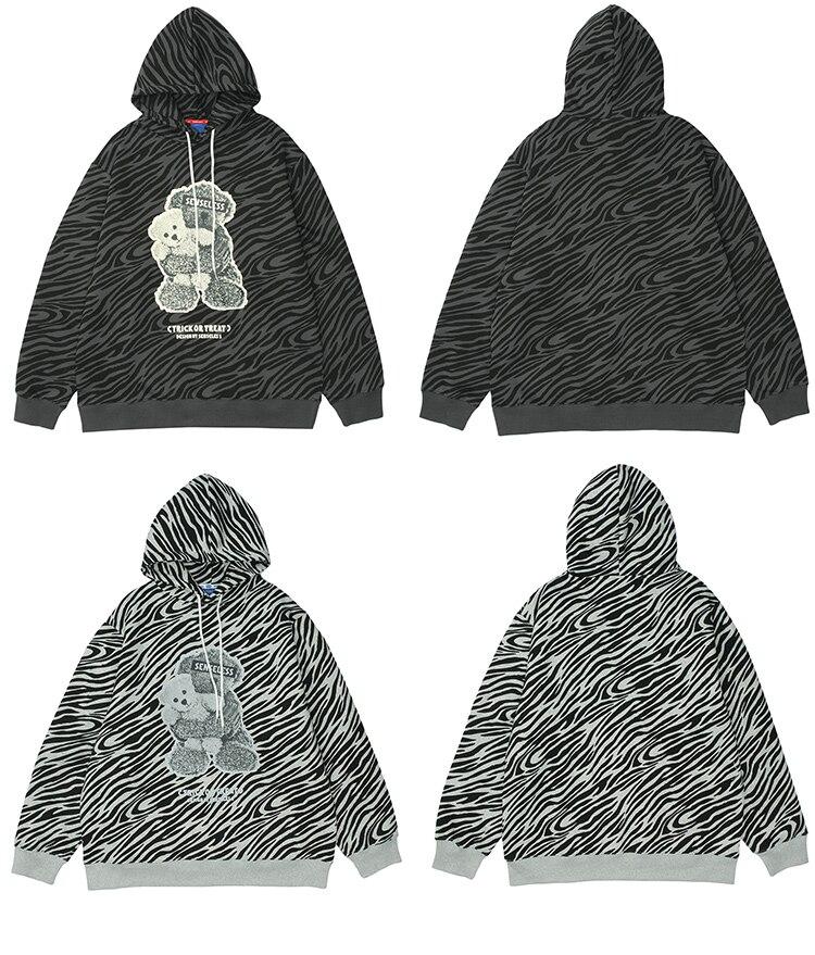 Men's zebra striped furry cartoon bear printed hoodie in light gray and dark gray, showcasing a playful design and cozy fleece material.