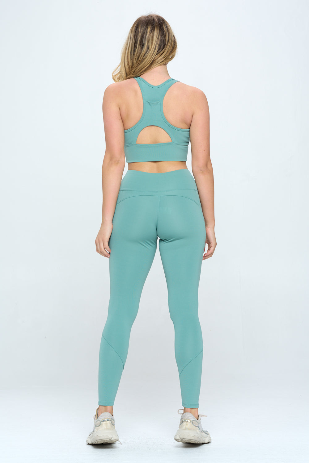 A stylish 2 Piece Activewear Set featuring cut-out details, high waist design, and cropped length, perfect for workouts and casual wear.