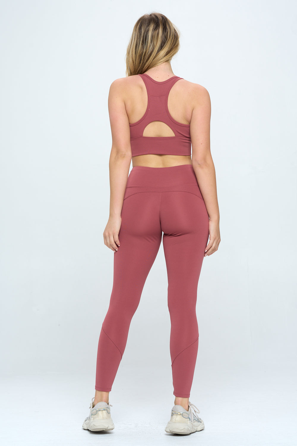 A stylish 2 Piece Activewear Set featuring cut-out details, high waist design, and cropped length, perfect for workouts and casual wear.