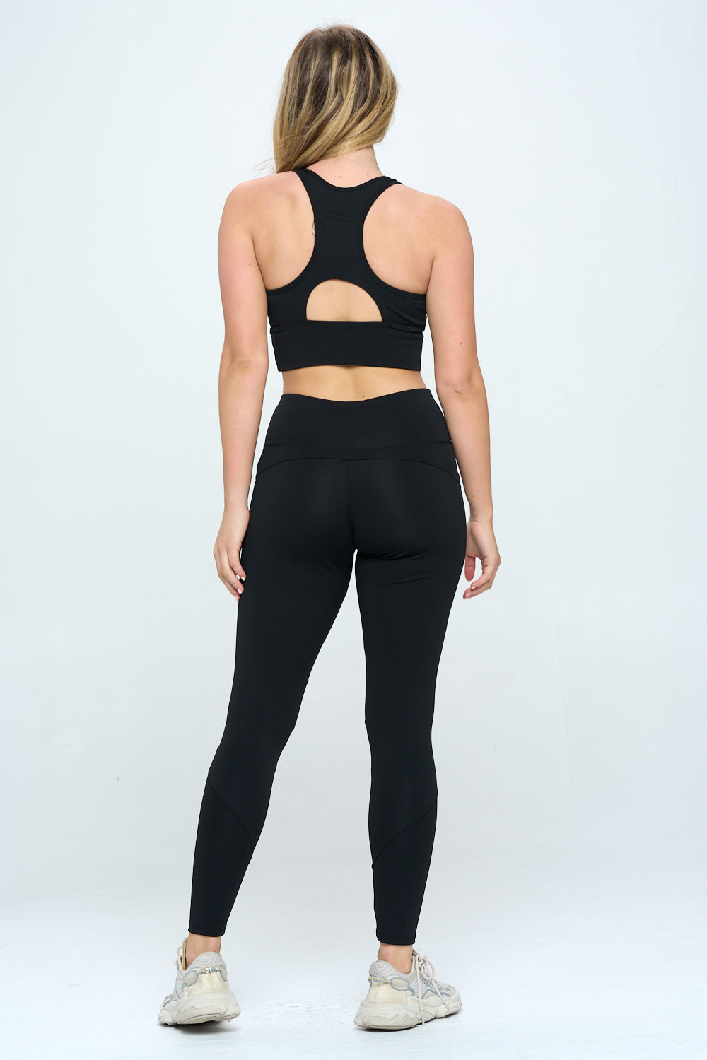 A stylish 2 Piece Activewear Set featuring cut-out details, high waist design, and cropped length, perfect for workouts and casual wear.