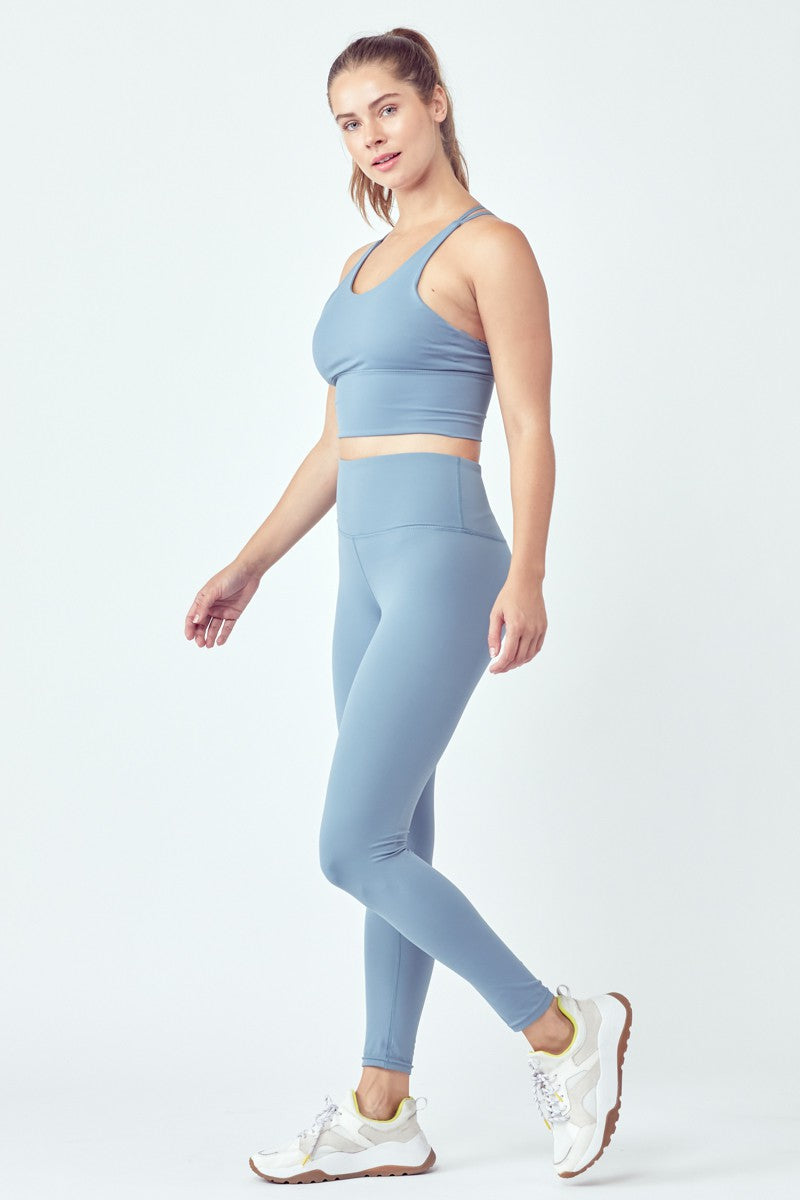 Person wearing blue workout outfit.