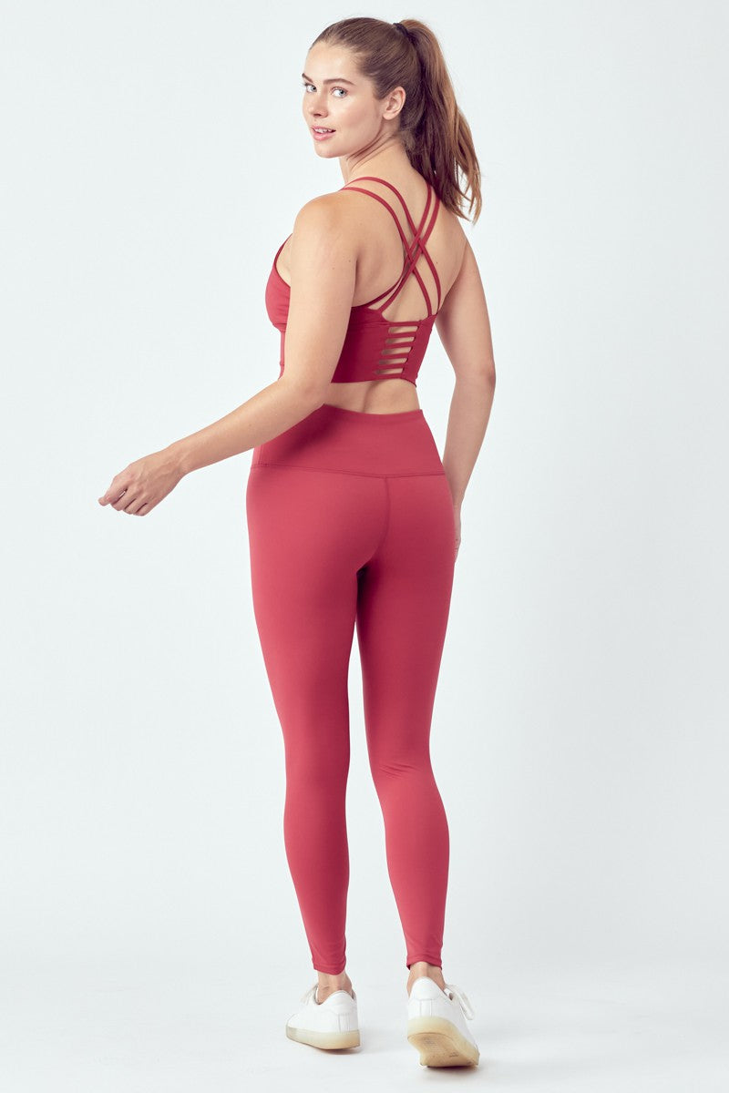 Woman in red workout attire.