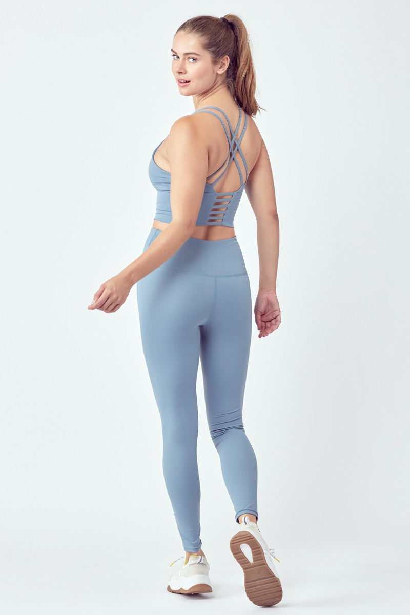 Woman in blue workout attire.