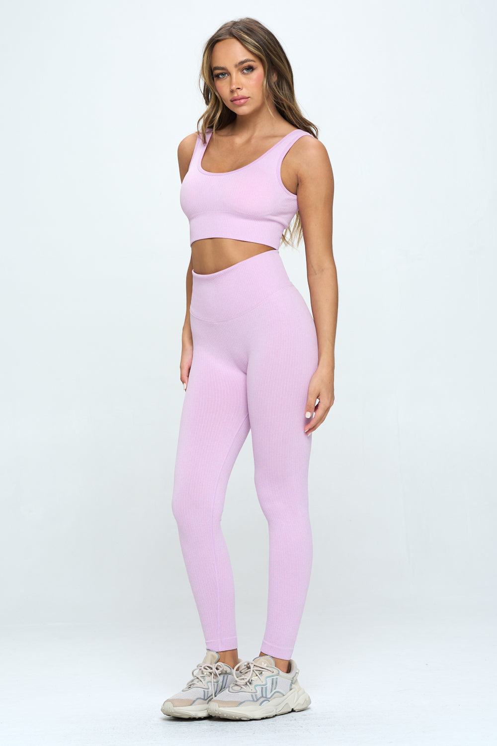 A stylish 2 Piece Seamless Ribbed Set featuring a high-waisted cropped top and matching bottoms in multiple colors, perfect for workouts and casual wear.