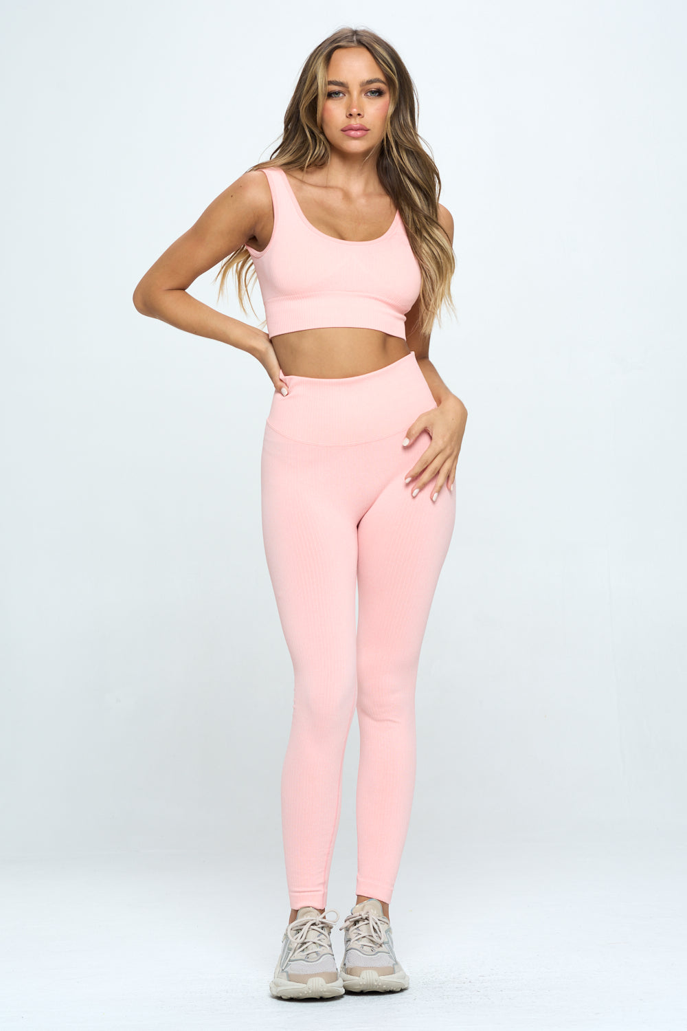 A stylish 2 Piece Seamless Ribbed Set featuring a high-waisted cropped top and matching bottoms in multiple colors, perfect for workouts and casual wear.