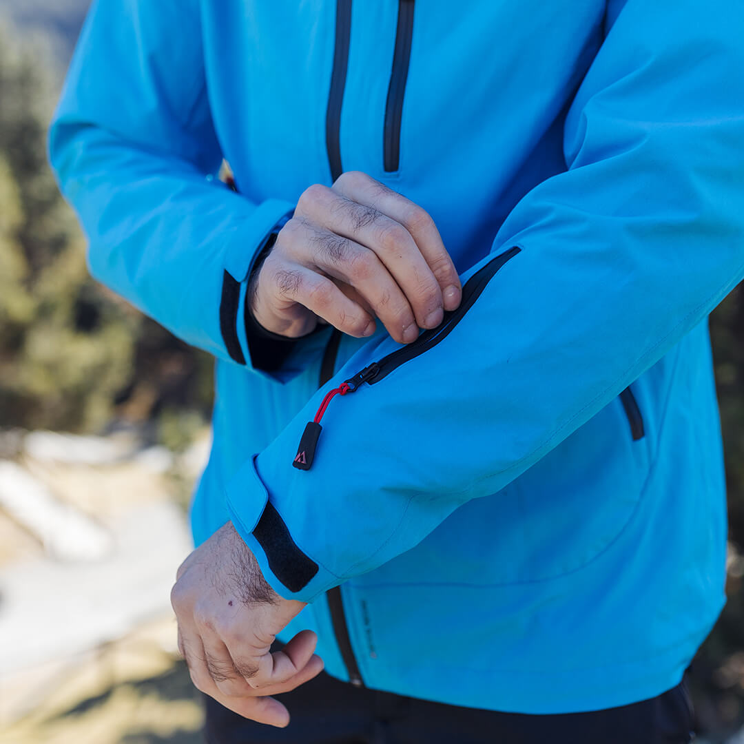 Adventure 2.0 Men Light Blue jacket featuring multiple pockets and eco-friendly materials, perfect for outdoor activities.