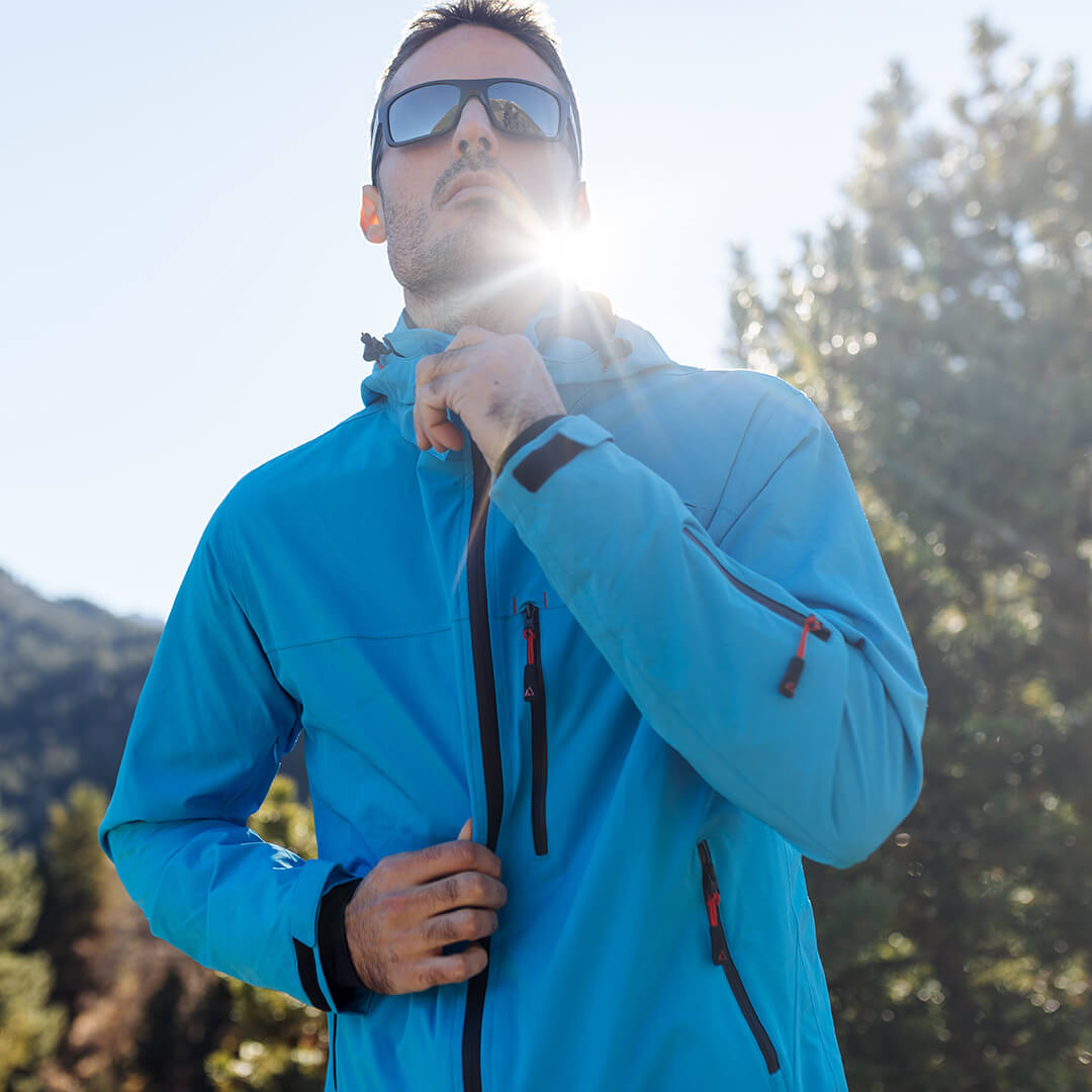 Adventure 2.0 Men Light Blue jacket featuring multiple pockets and eco-friendly materials, perfect for outdoor activities.