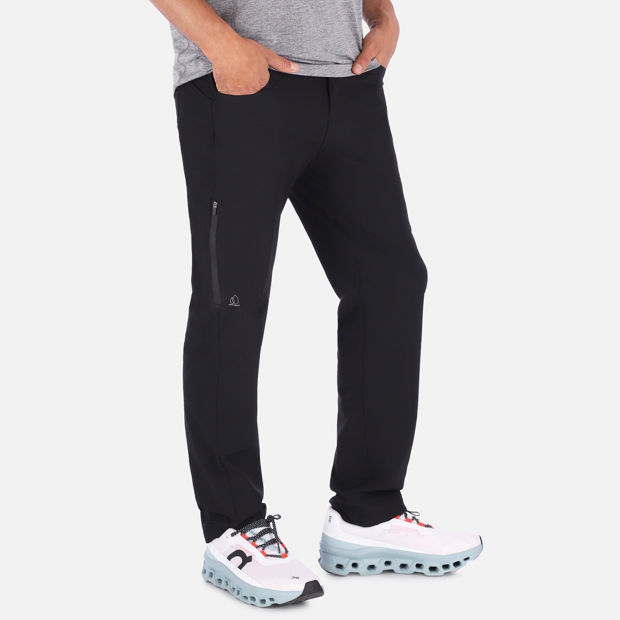 Men's black Adventure Pants featuring multiple pockets and a stylish design, perfect for outdoor activities.