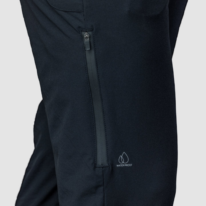 Men's black Adventure Pants featuring multiple pockets and a stylish design, perfect for outdoor activities.