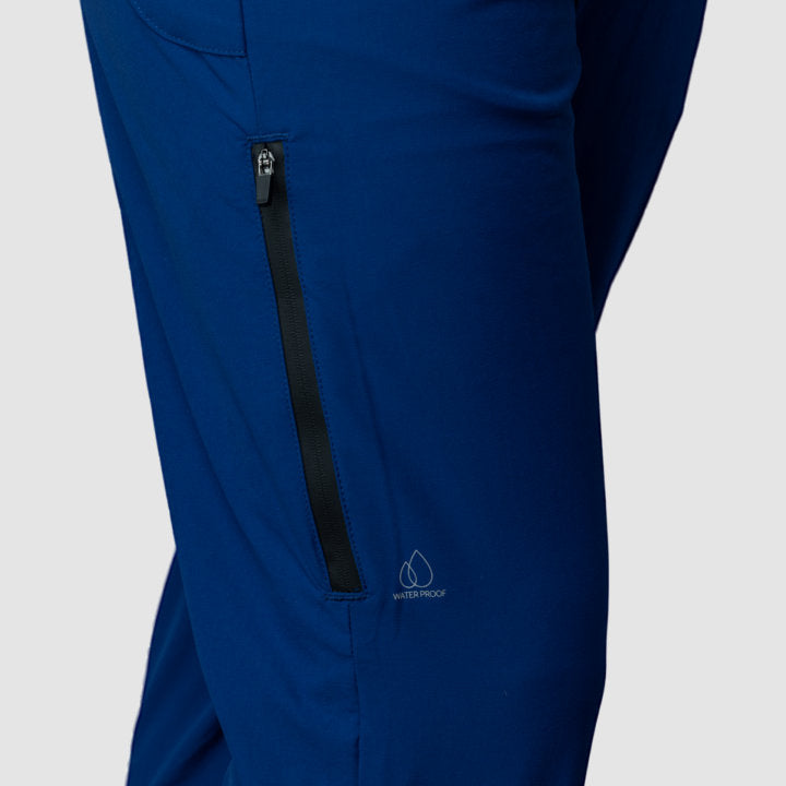 Men's navy blue Adventure Pants featuring multiple pockets and a stylish design, perfect for outdoor activities.