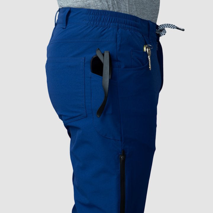 Men's navy blue Adventure Pants featuring multiple pockets and a stylish design, perfect for outdoor activities.