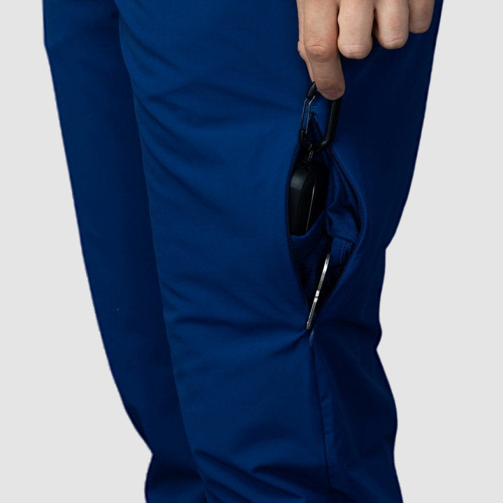 Men's navy blue Adventure Pants featuring multiple pockets and a stylish design, perfect for outdoor activities.