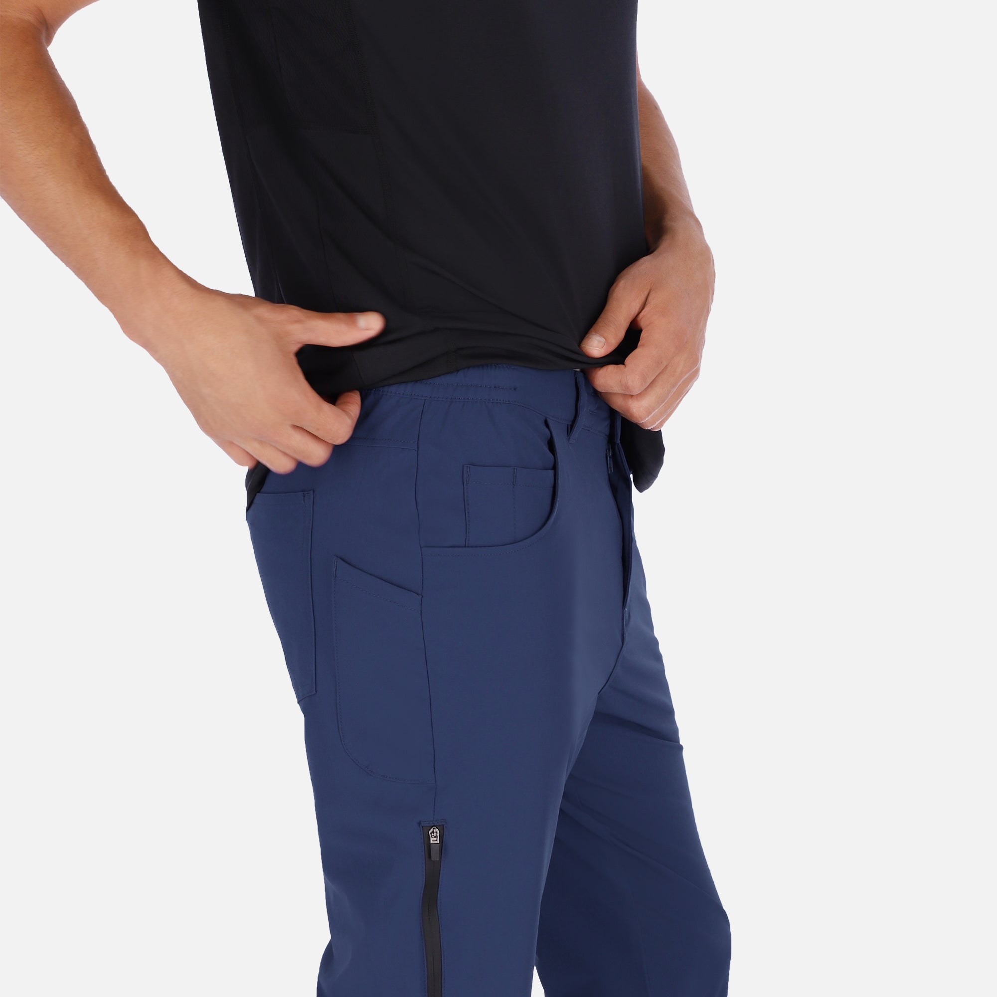 Men's navy blue Adventure Pants featuring multiple pockets and a stylish design, perfect for outdoor activities.