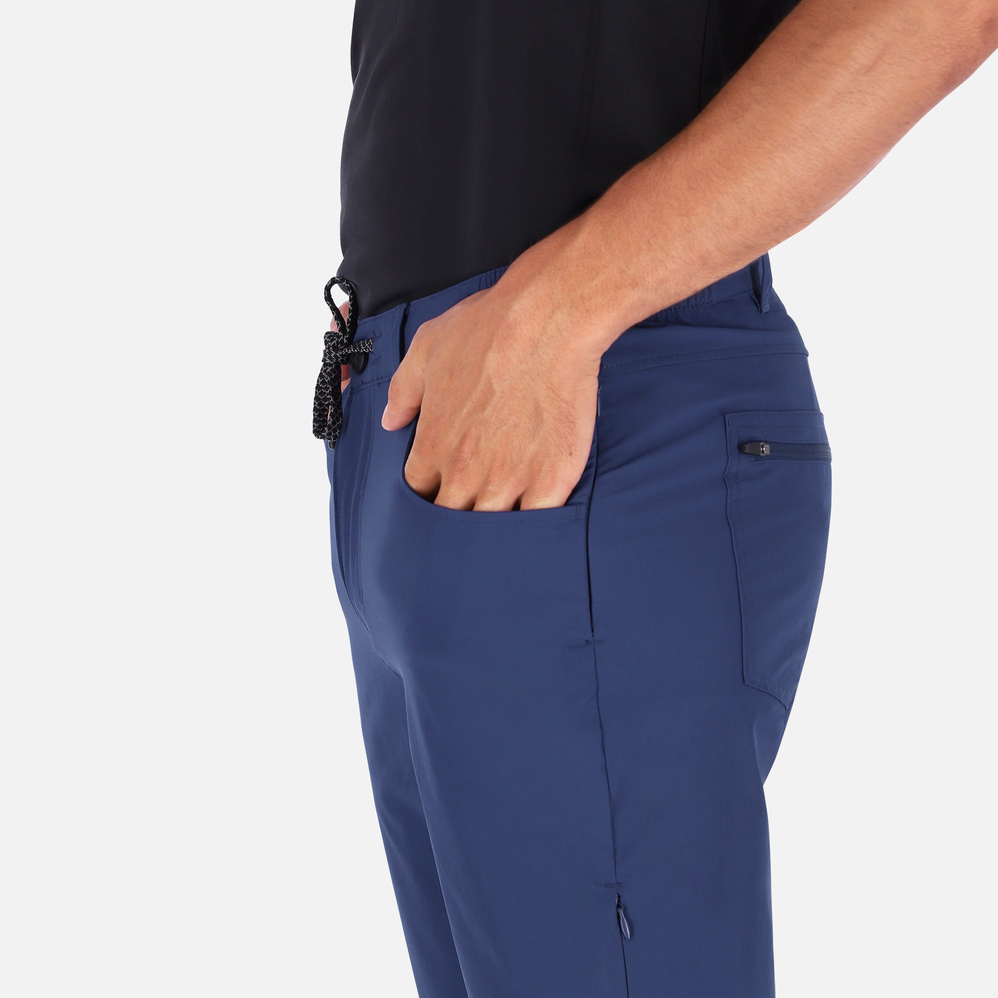 Men's navy blue Adventure Pants featuring multiple pockets and a stylish design, perfect for outdoor activities.