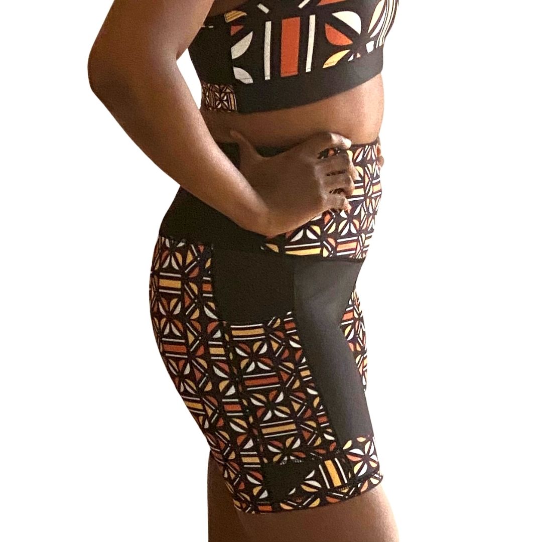 Adyre High Rise Biker Shorts featuring a vibrant Batik pattern, high waist design, and side pocket for phone storage.