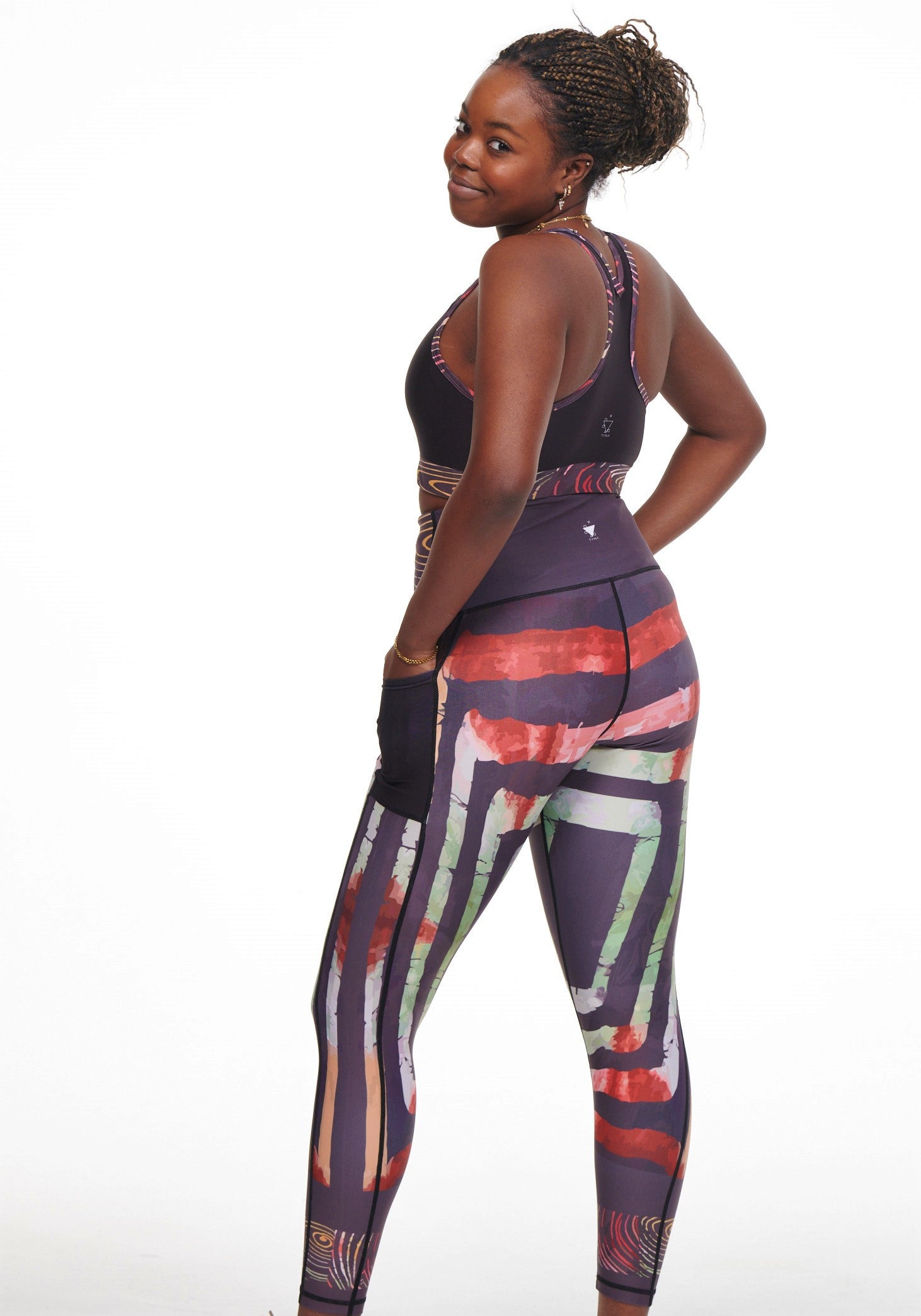 Adyre on Brocade Vibrant Leggings featuring a colorful African print with side pockets, perfect for workouts and casual wear.