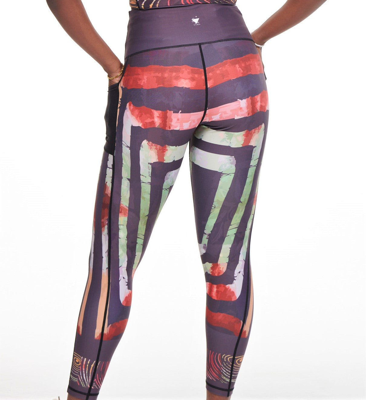 Adyre on Brocade Vibrant Leggings featuring a colorful African print with side pockets, perfect for workouts and casual wear.