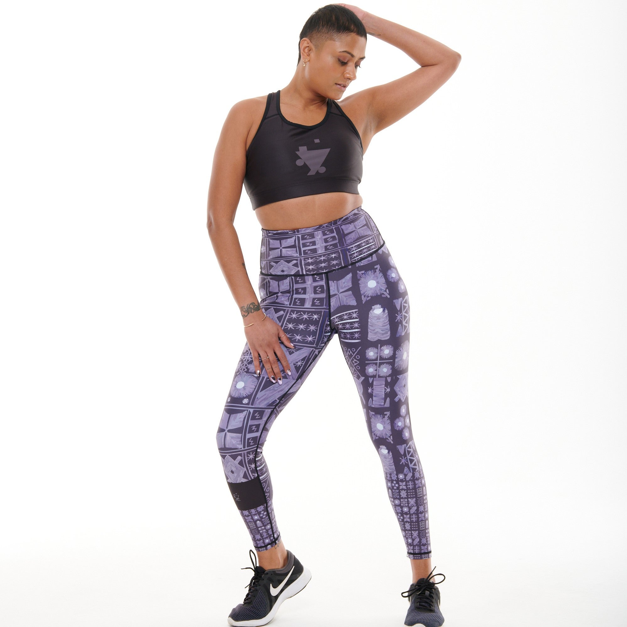 TYNA Adyre Vibrant Leggings featuring a colorful Adire print, designed for high performance with an engineered waistband and removable drawstring.