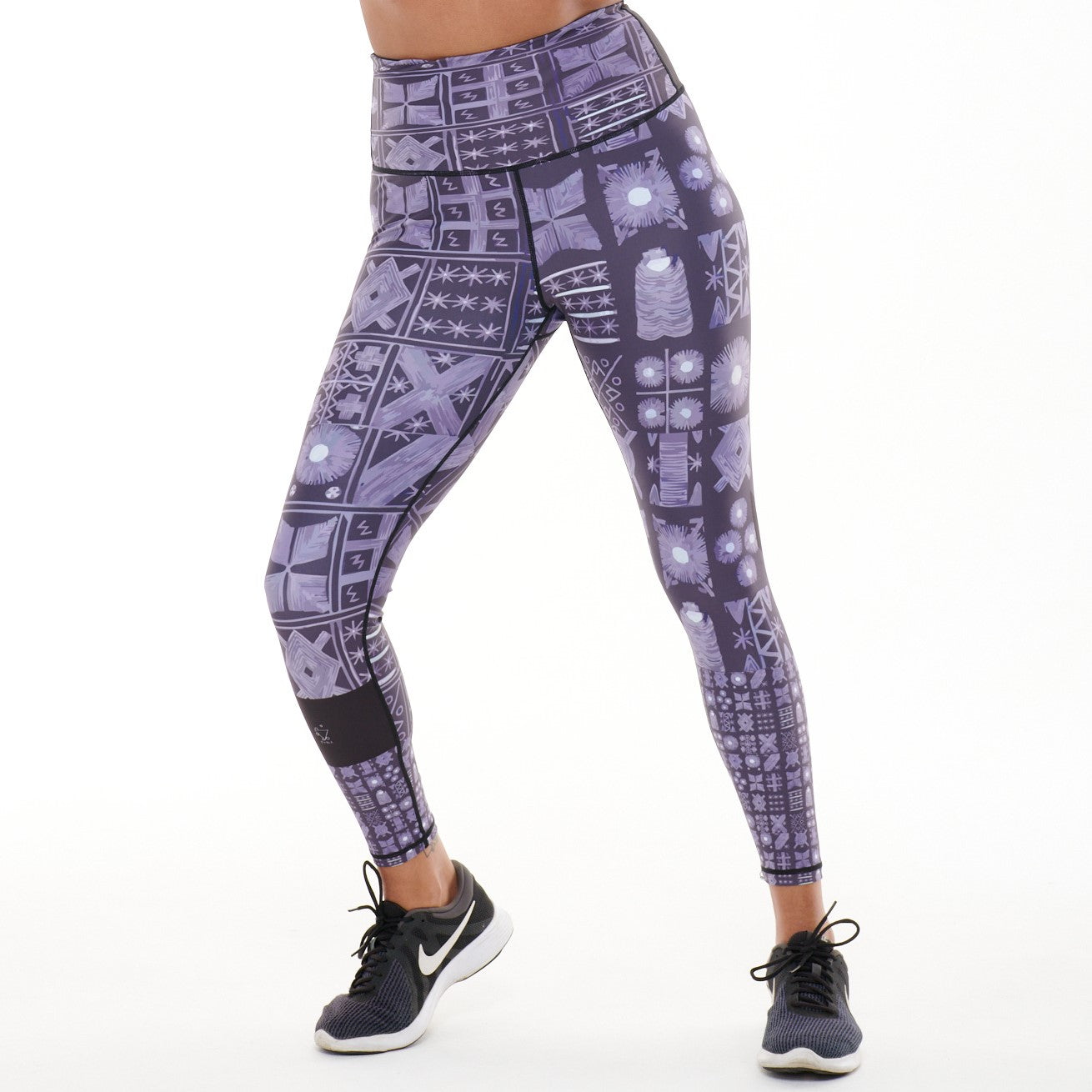 TYNA Adyre Vibrant Leggings featuring a colorful Adire print, designed for high performance with an engineered waistband and removable drawstring.