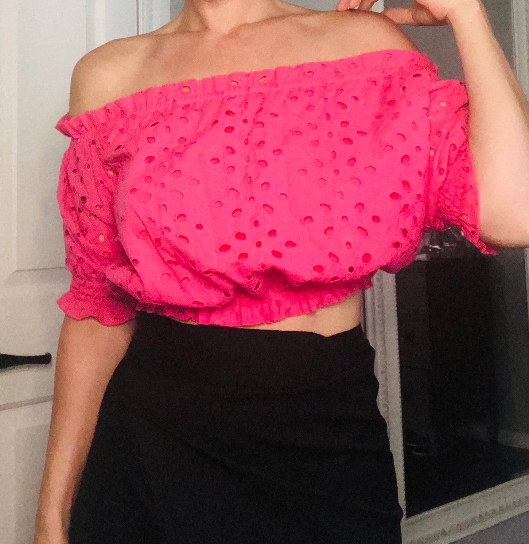 Azalea Pink Eyelet Off Shoulder Crop Top featuring a shoulder-baring neckline and ruffled elastic finish, made from cotton and polyester.