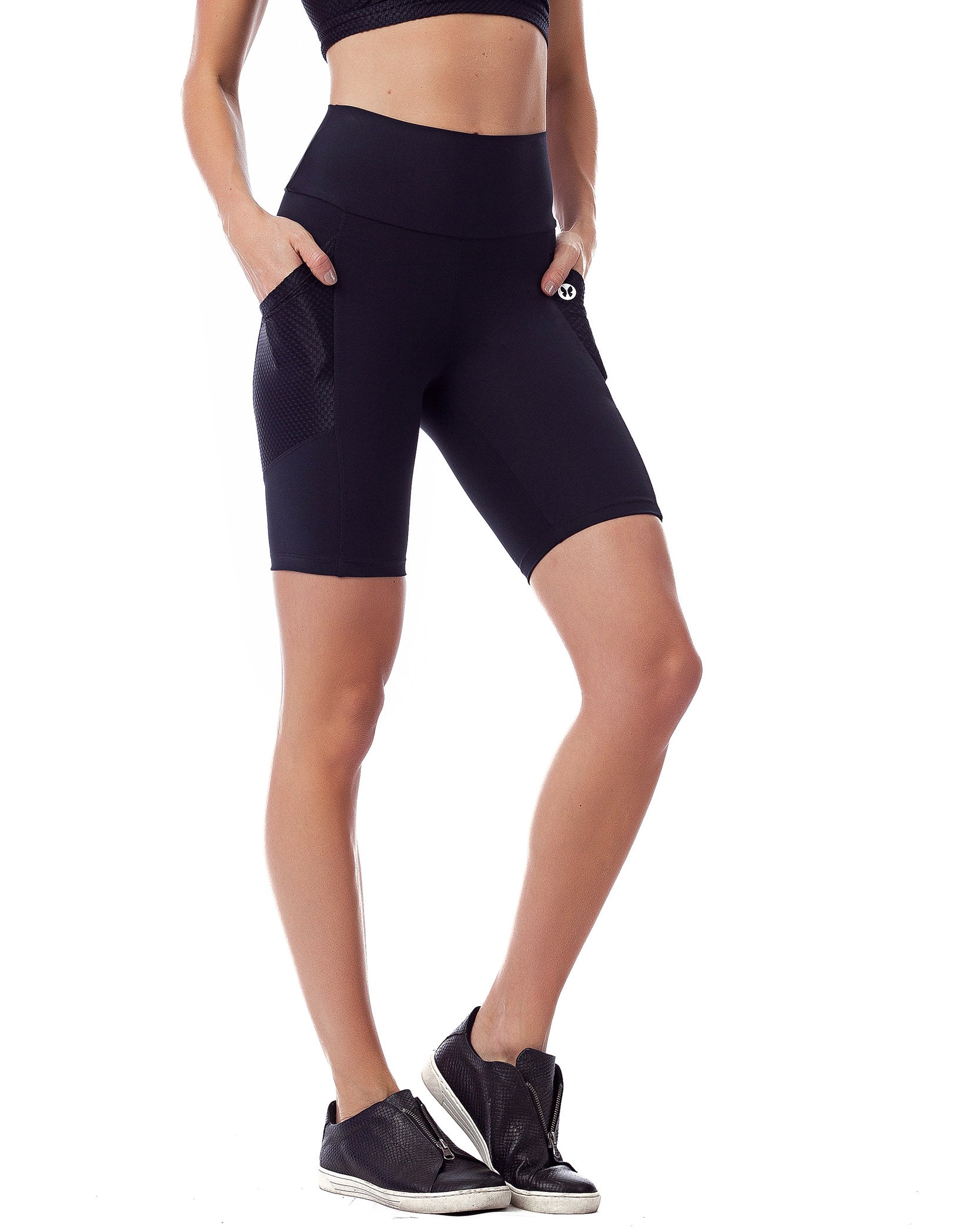 Black high waisted biker shorts featuring pockets, made from breathable Supplex fabric, designed for comfort and support during workouts.