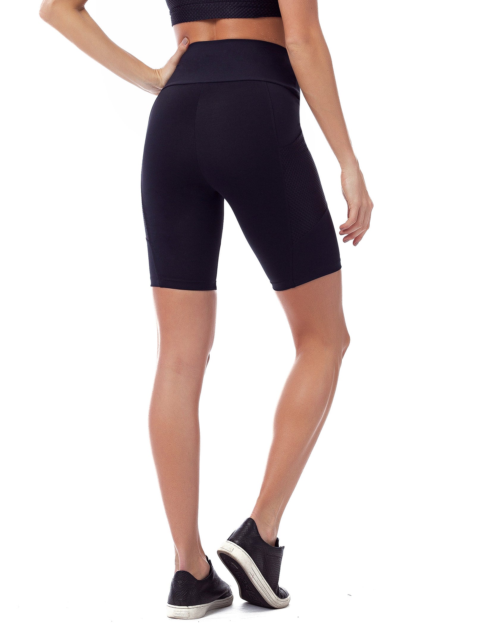 Black high waisted biker shorts featuring pockets, made from breathable Supplex fabric, designed for comfort and support during workouts.