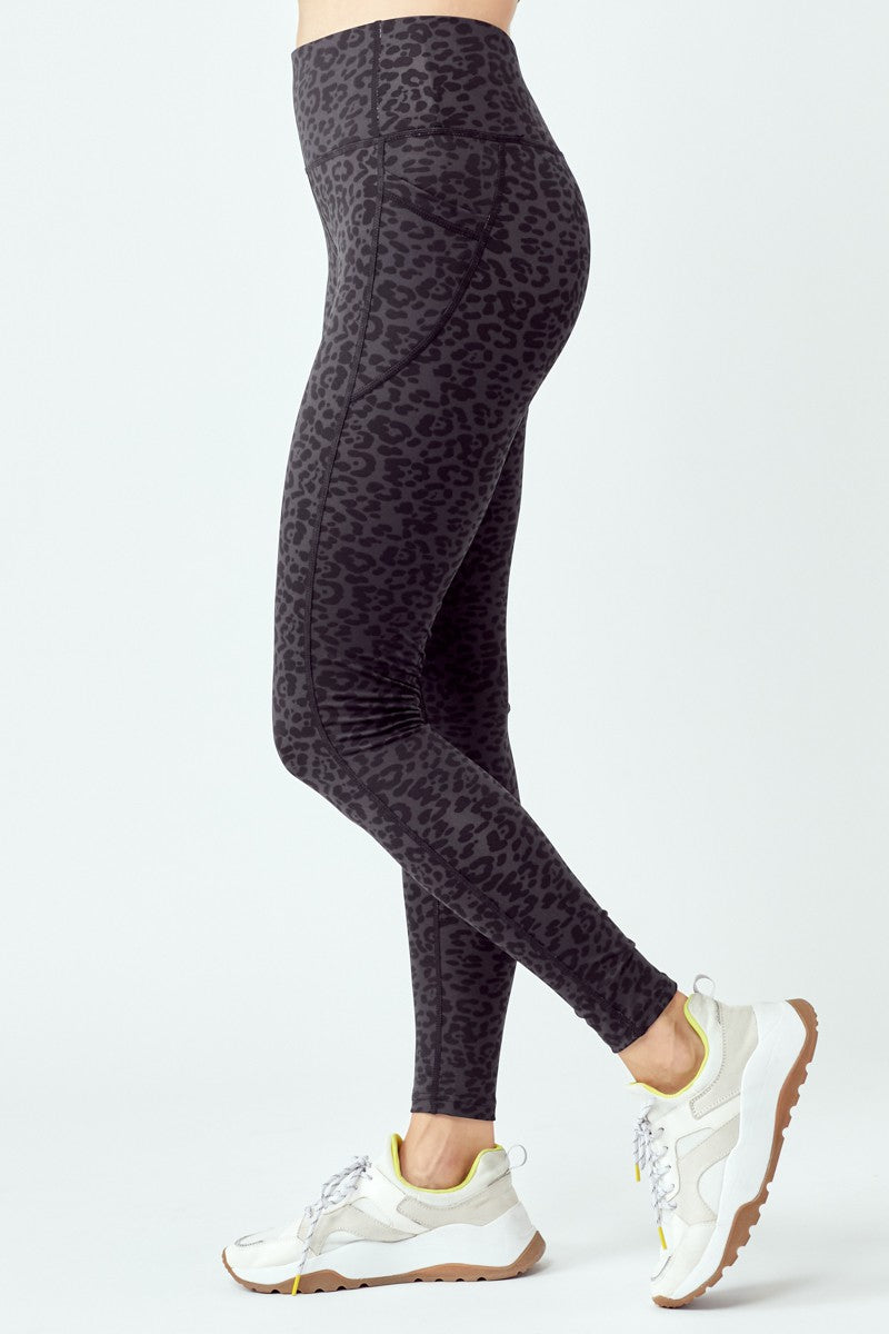 A pair of stylish black leopard leggings featuring a high waist and flat seams, perfect for workouts and casual wear.