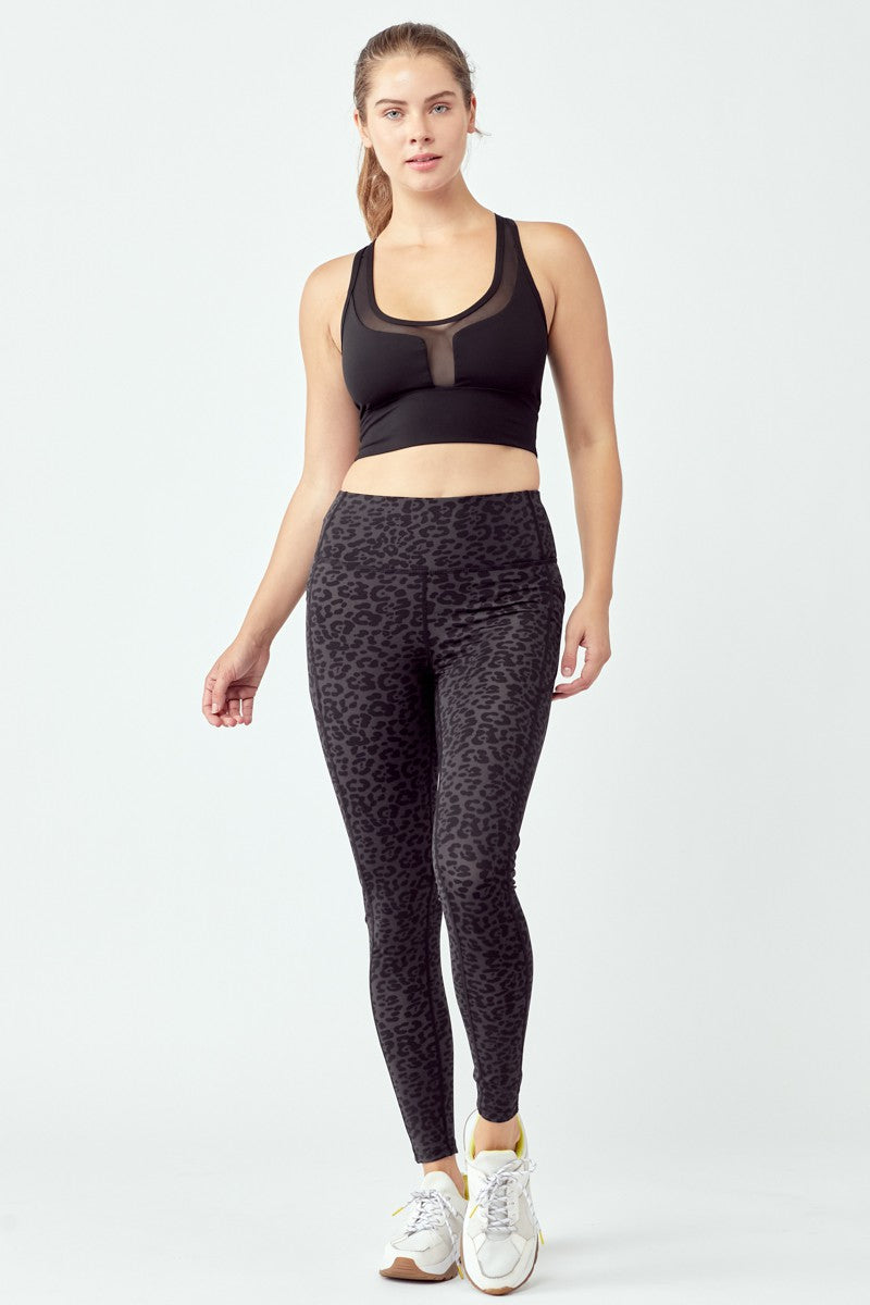 A pair of stylish black leopard leggings featuring a high waist and flat seams, perfect for workouts and casual wear.