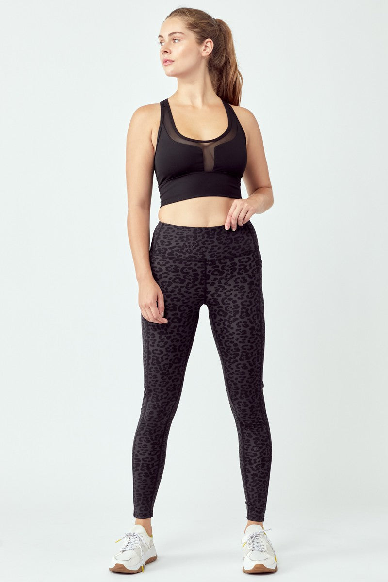 A pair of stylish black leopard leggings featuring a high waist and flat seams, perfect for workouts and casual wear.