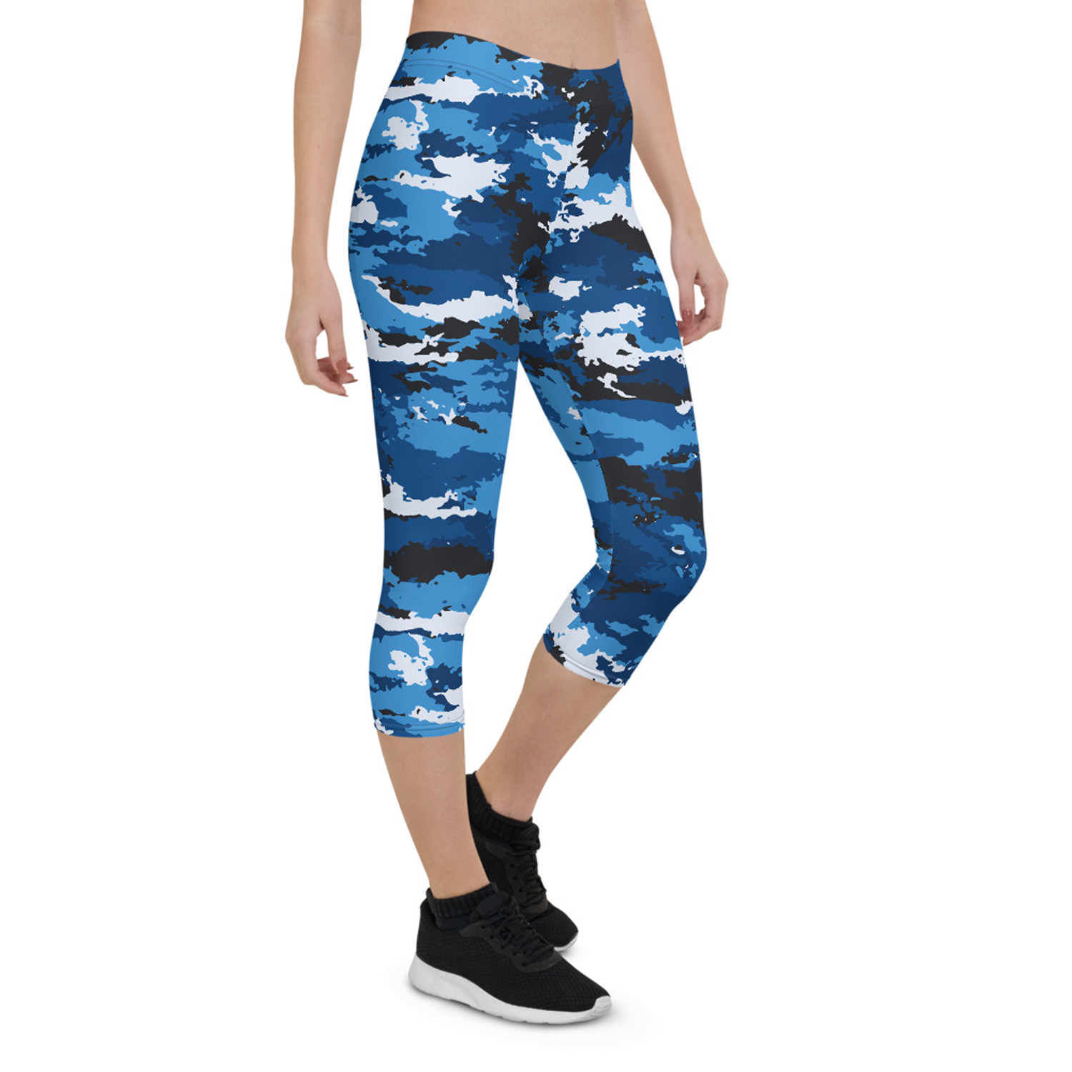 A pair of women's blue camo capri leggings, showcasing a unique and vibrant design, made from high-performance fabric for comfort and flexibility during workouts.