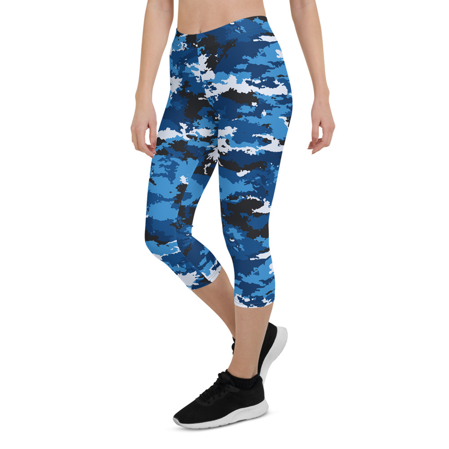 A pair of women's blue camo capri leggings, showcasing a unique and vibrant design, made from high-performance fabric for comfort and flexibility during workouts.