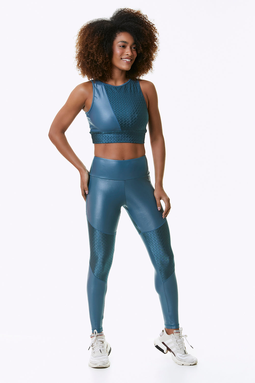 Blue Magic Cropped Sports Bra featuring a textured geometric pattern and high-shine fabric, designed for medium support and active movement.