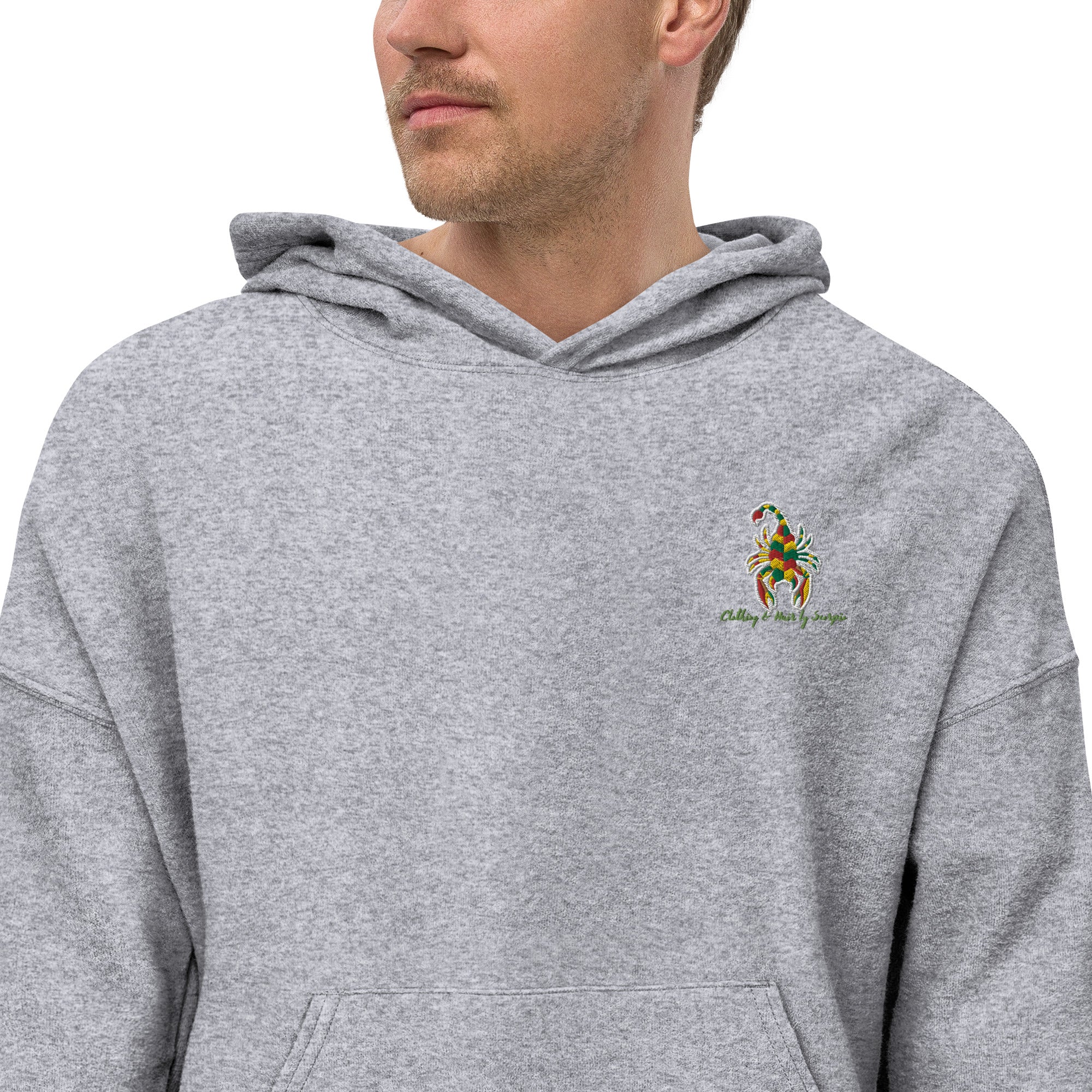 A soft and comfortable CHBS unisex sueded fleece hoodie in a casual style, featuring a front pouch pocket and dropped shoulder design.