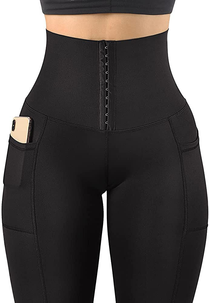 A pair of black corset leggings featuring a high waist, cropped length, and side pockets, made from soft, stretchy nylon fabric.