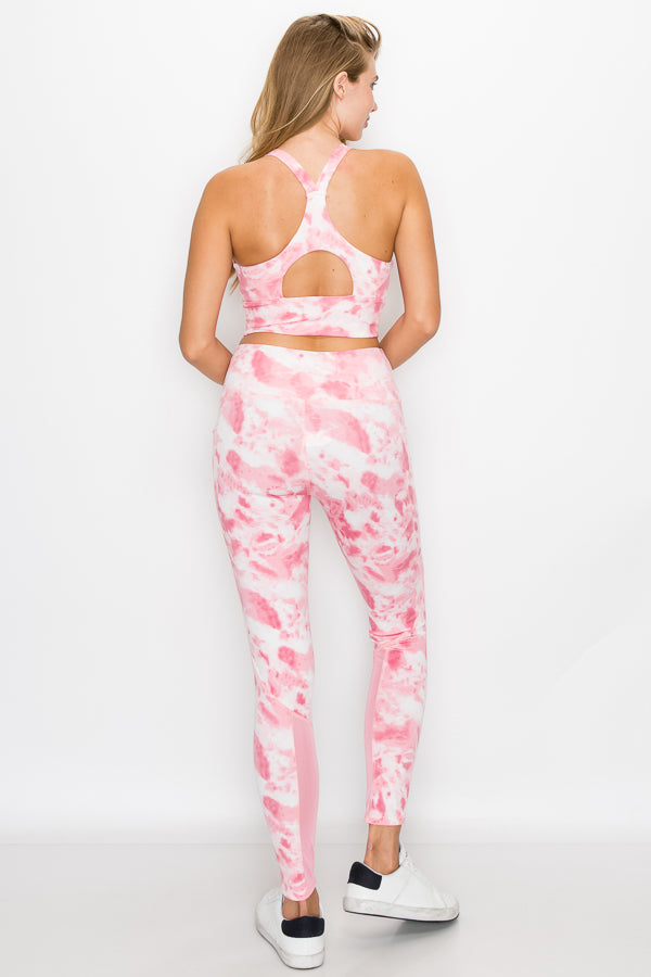 A stylish crop top activewear set featuring a crop top and high-waisted leggings in various trendy patterns, perfect for summer workouts.