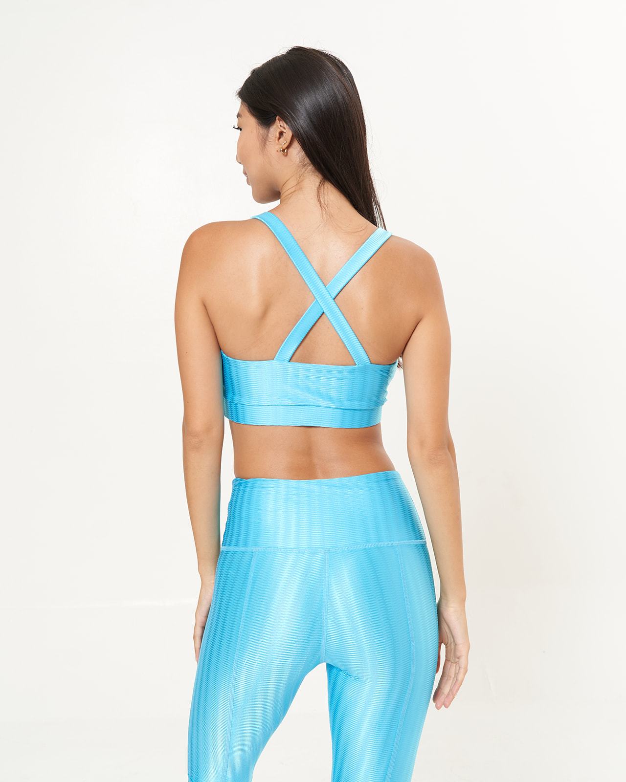 Cross Back Performance Bra Top in Blue Sky Zap Pattern, featuring double-layered design and wide cross-back straps for support.