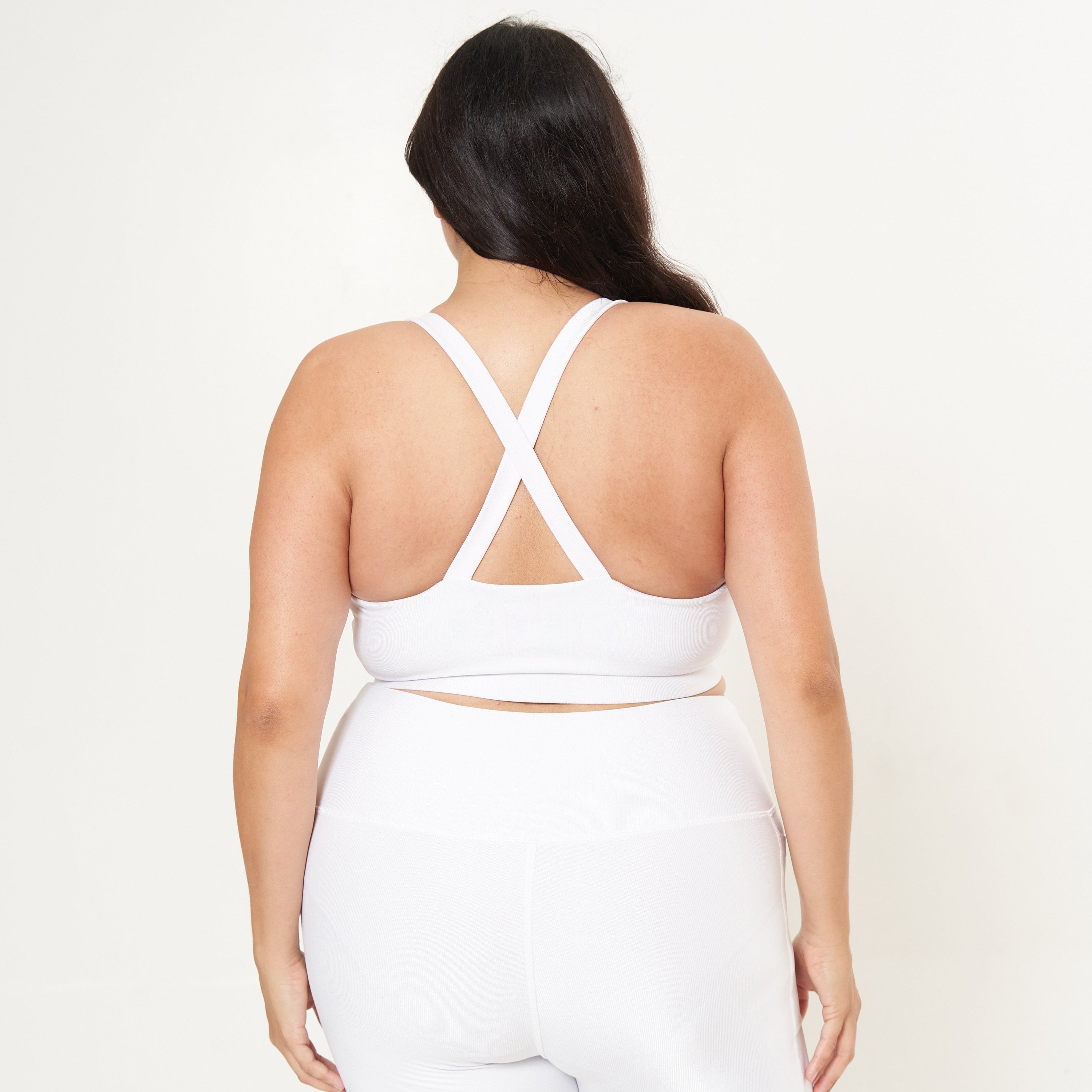 Cross Back Performance Bra Top in white rib pattern, featuring double-layered construction and wide cross-back straps for support.