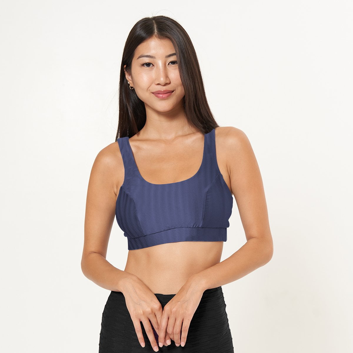 Lola Getts Double Scoop Bra Top in Midnight Zap Pattern, showcasing its stylish design and supportive features for workouts.