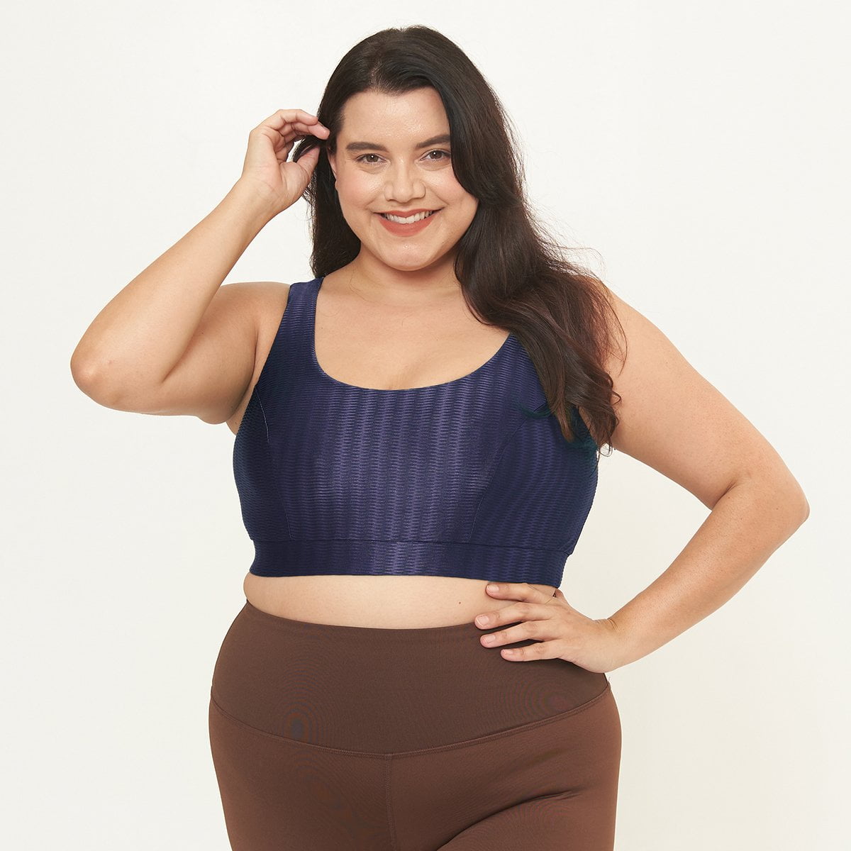 Lola Getts Double Scoop Bra Top in Midnight Zap Pattern, showcasing its stylish design and supportive features for workouts.