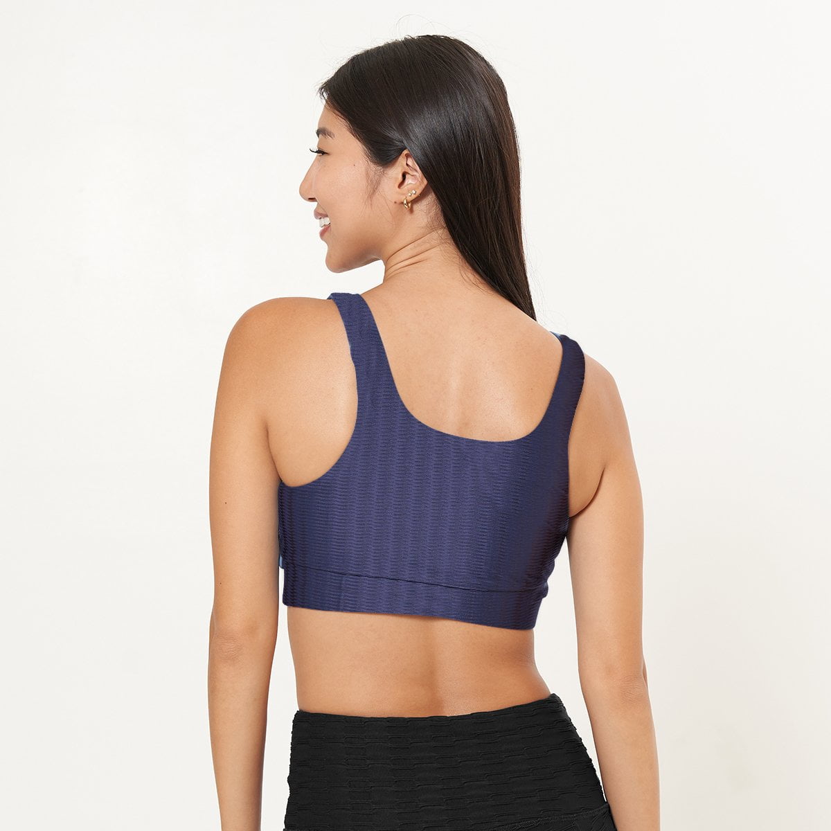 Lola Getts Double Scoop Bra Top in Midnight Zap Pattern, showcasing its stylish design and supportive features for workouts.