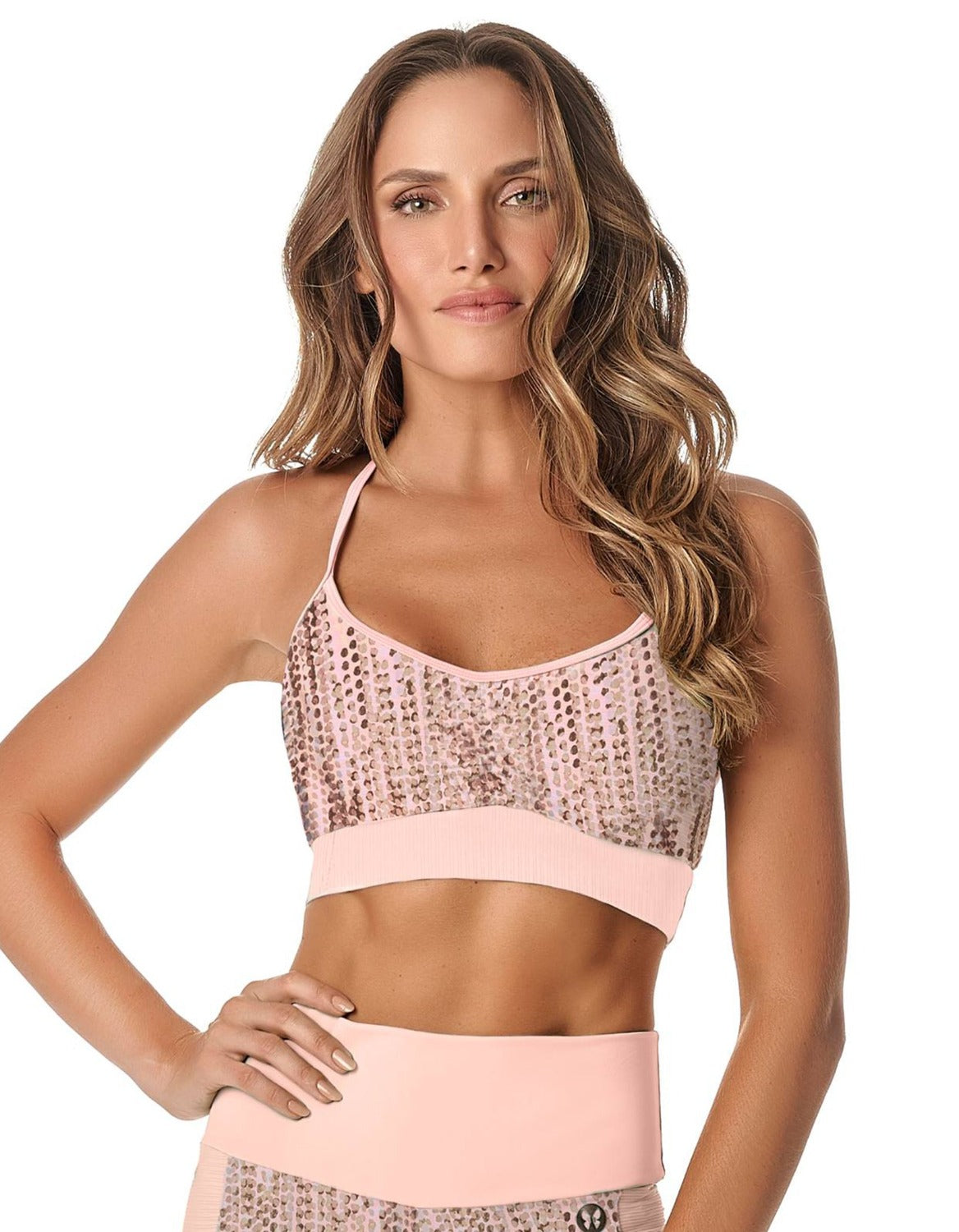 Drizzle Sports Bra featuring a unique dotted pattern and blush pink details, designed for style and comfort during workouts.