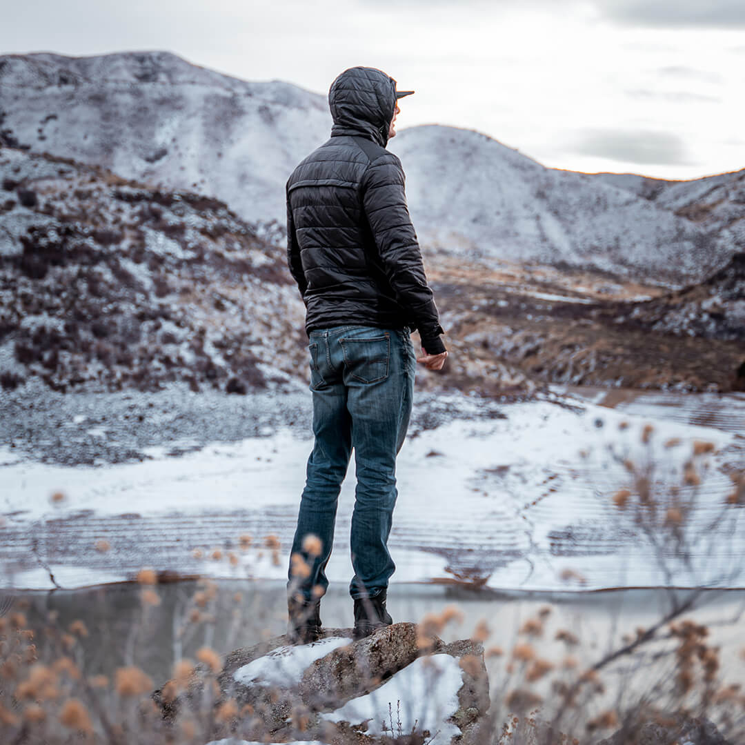 Men's EcoDown Jacket in black, made from recycled materials, featuring a lightweight design and built-in sleeve gloves.