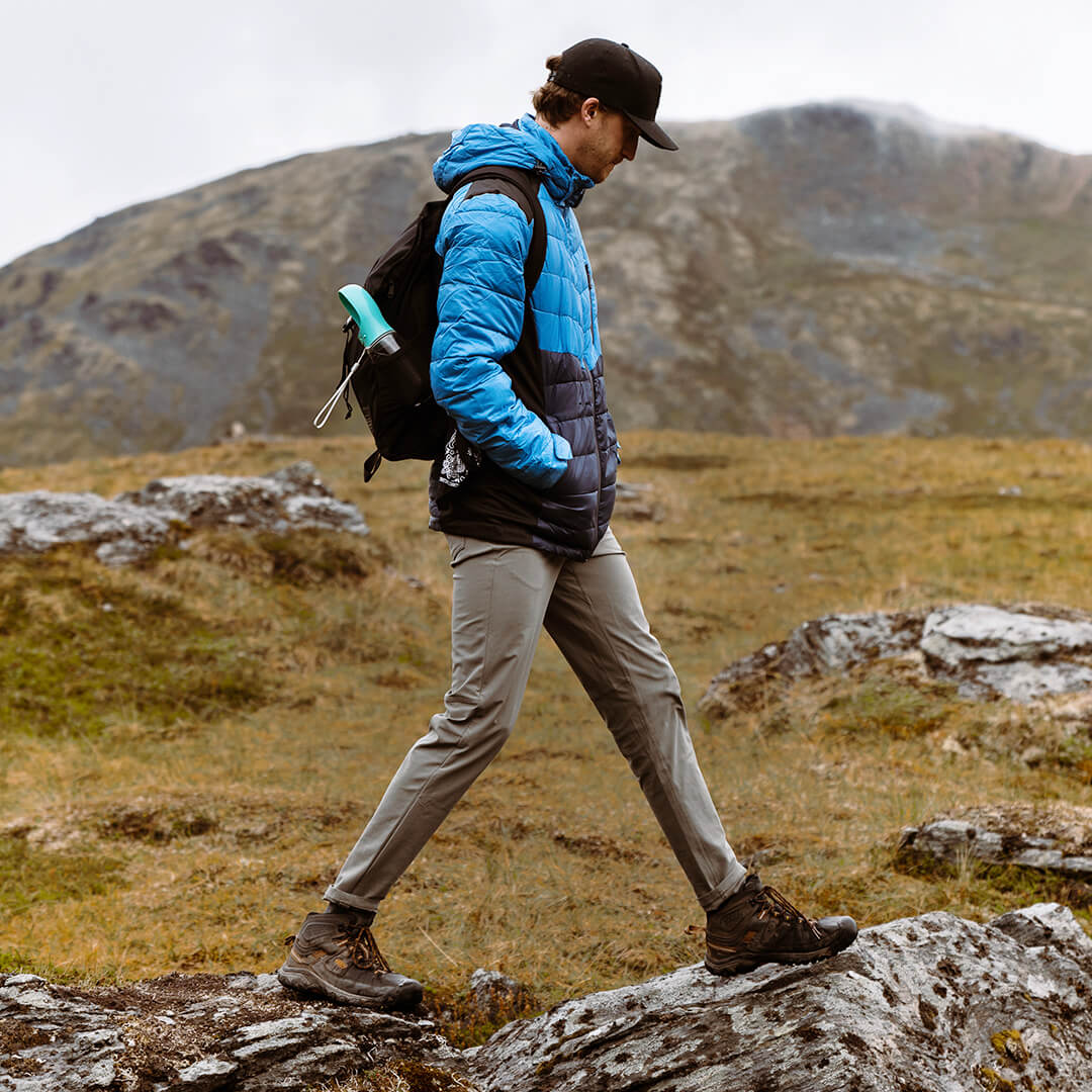 Men's EcoDown Jacket in blue, made from recycled materials, featuring a lightweight design and built-in sleeve gloves.