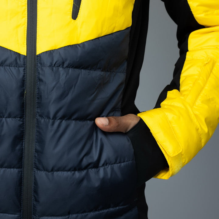 Men's EcoDown Jacket in yellow, made from recycled materials, featuring elastic hems and built-in sleeve gloves.