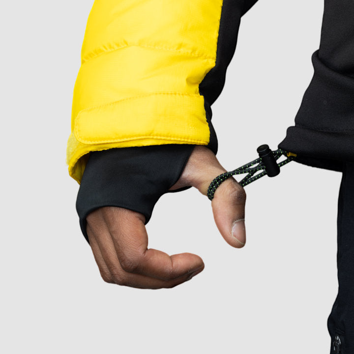 Men's EcoDown Jacket in yellow, made from recycled materials, featuring elastic hems and built-in sleeve gloves.