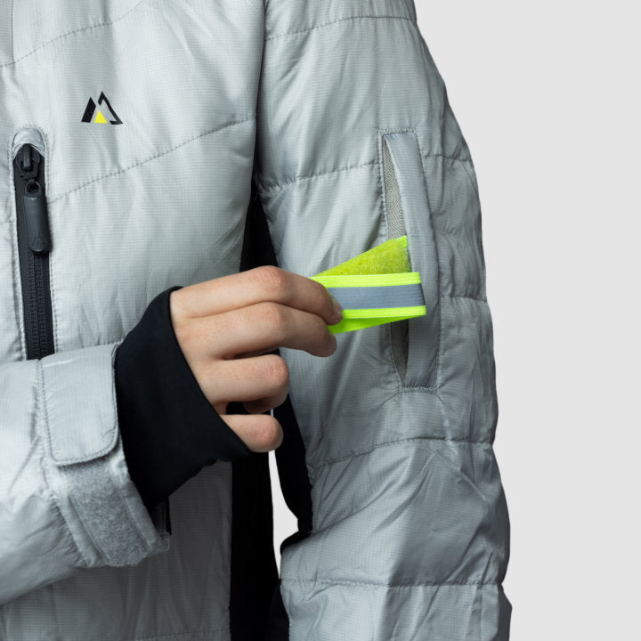 EcoDown Jacket for Women in Gray, featuring a lightweight design and built-in sleeve gloves, made from recycled materials.